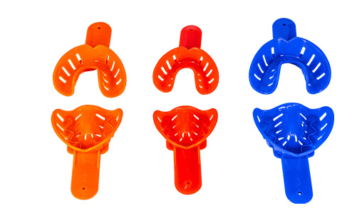 Dental impression trays and dispensing gun